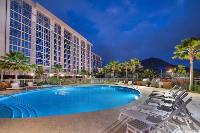 view of swimming pool featuring a mountain view and a patio area