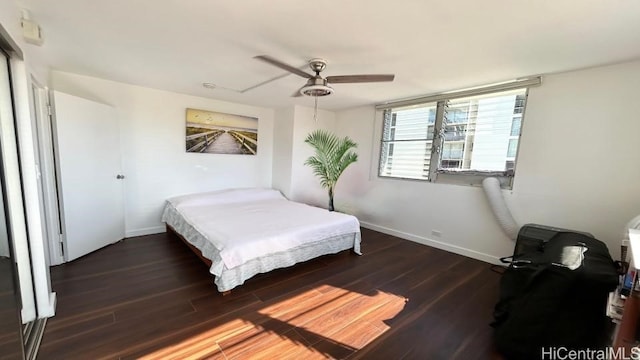 bedroom featuring ceiling fan and dark hardwood / wood-style floors