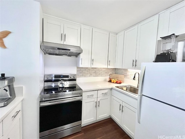 kitchen with ventilation hood, sink, white cabinets, white fridge, and electric stove