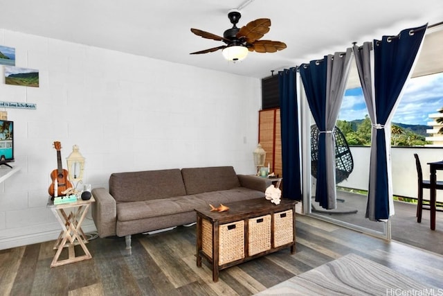 living room with hardwood / wood-style floors and ceiling fan