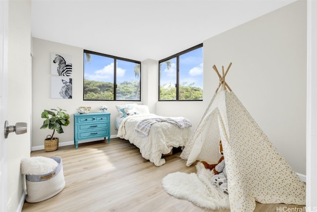 bedroom with light hardwood / wood-style floors