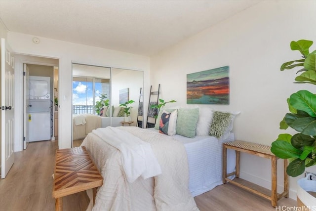 bedroom featuring wood-type flooring and a closet