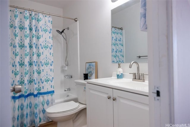 full bath featuring shower / bathtub combination with curtain, toilet, and vanity