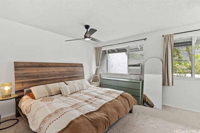 carpeted bedroom featuring a textured ceiling, cooling unit, and ceiling fan