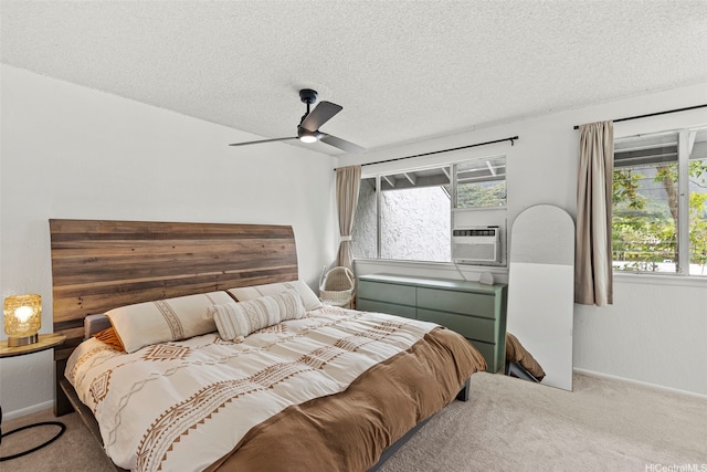 47-228 Hui Akikiki Pl Unit A/701, Kaneohe, HI 96744 - bedroom with carpet floors, cooling unit, a textured ceiling, baseboards, and a ceiling fan