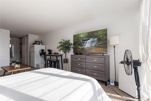 bedroom with white refrigerator