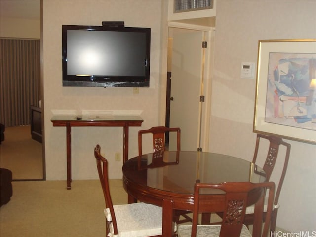 view of carpeted dining space