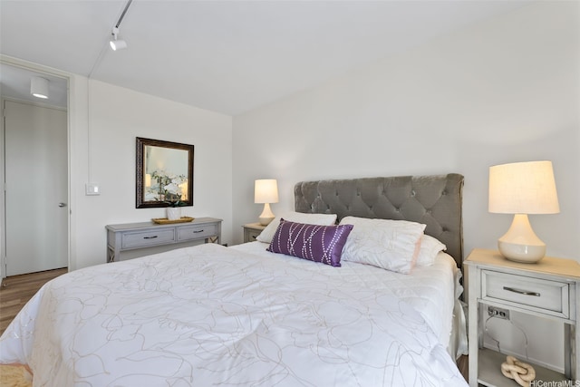 bedroom featuring wood finished floors