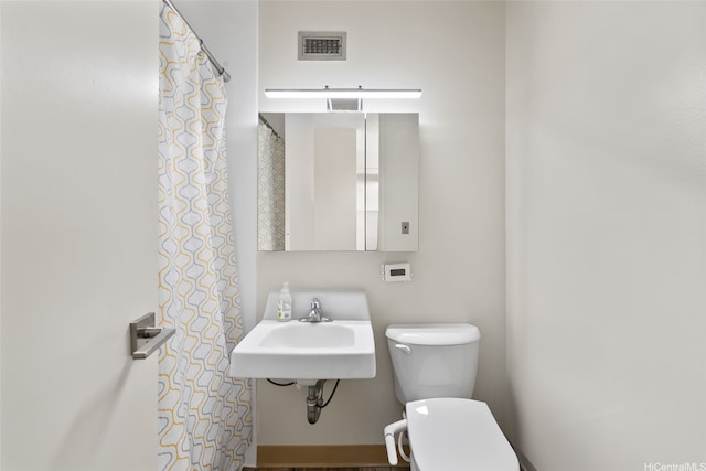 bathroom with a sink and toilet