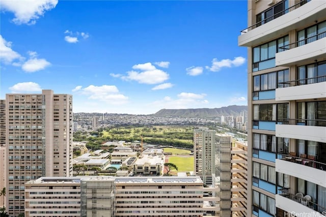 property's view of city with a mountain view