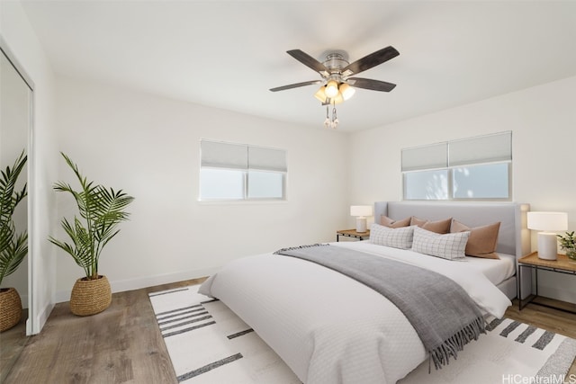 bedroom featuring hardwood / wood-style floors and ceiling fan