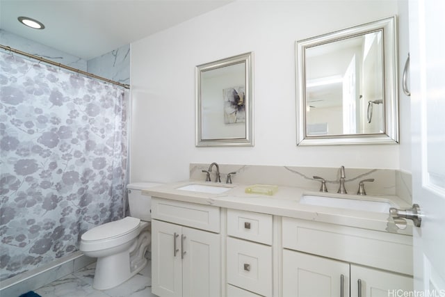 bathroom with vanity, curtained shower, and toilet