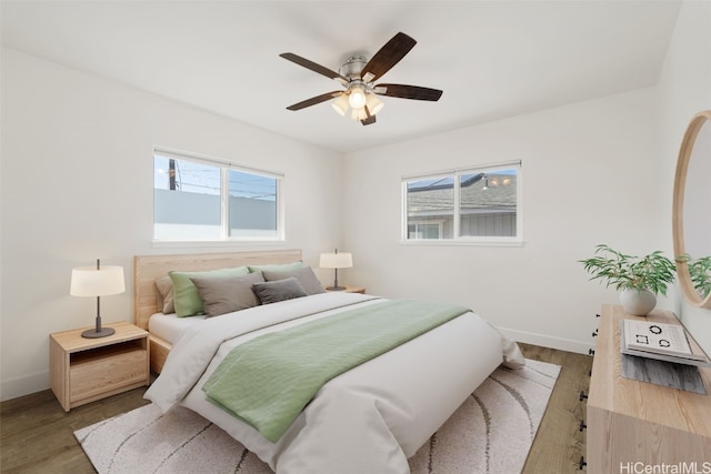 bedroom with light hardwood / wood-style flooring and ceiling fan