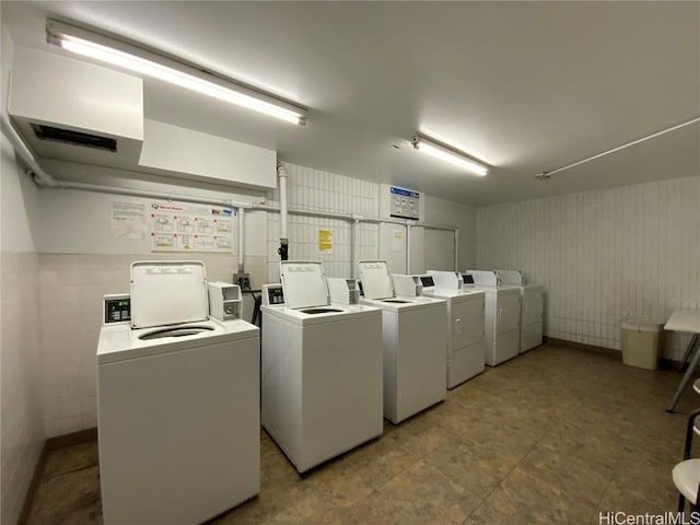 washroom with separate washer and dryer