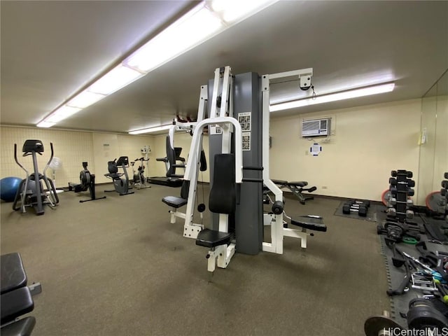 workout area featuring a wall mounted AC