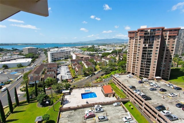 drone / aerial view featuring a view of city and a water view