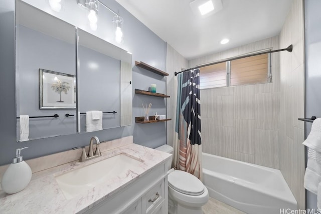 full bathroom with vanity, toilet, and shower / bath combo with shower curtain