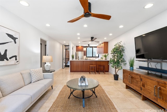 living area with light tile patterned flooring, recessed lighting, and baseboards