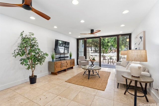 living area featuring a ceiling fan, recessed lighting, baseboards, and expansive windows