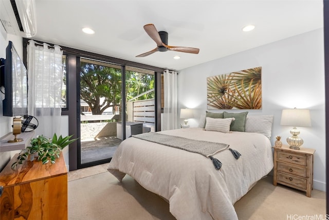 bedroom featuring a wall mounted air conditioner, access to outside, recessed lighting, a wall of windows, and light colored carpet