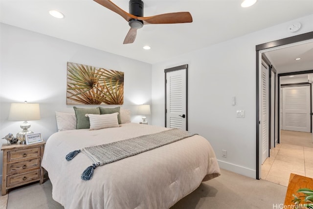 bedroom with recessed lighting, light colored carpet, baseboards, and ceiling fan