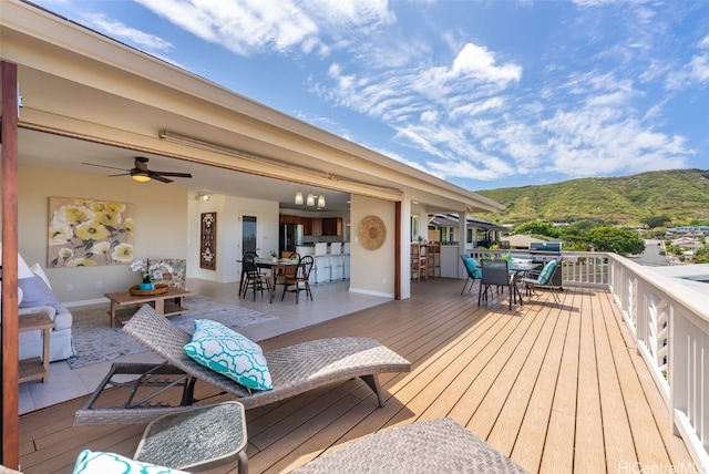 3515 Upper St, Honolulu, HI 96815 - wooden terrace featuring a mountain view, outdoor dining space, and a ceiling fan