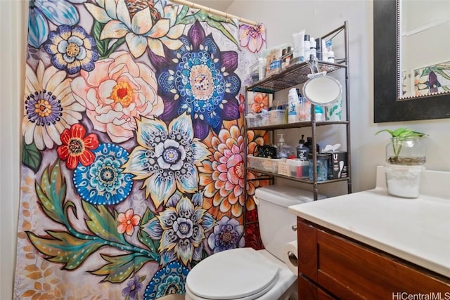 bathroom with vanity and toilet