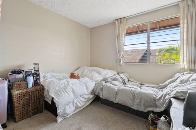 carpeted bedroom with a textured ceiling