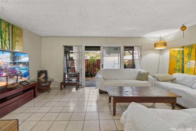 tiled living room featuring a textured ceiling