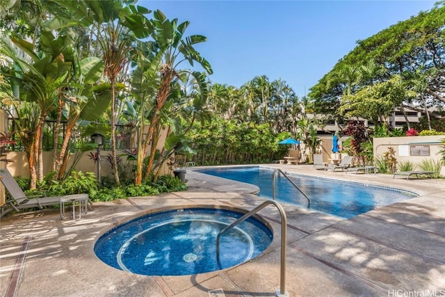 view of pool featuring a patio and a community hot tub