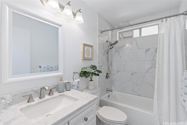 full bathroom with vanity, toilet, and shower / tub combo with curtain