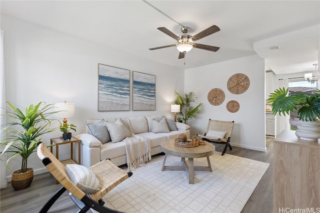 living room with hardwood / wood-style flooring and ceiling fan