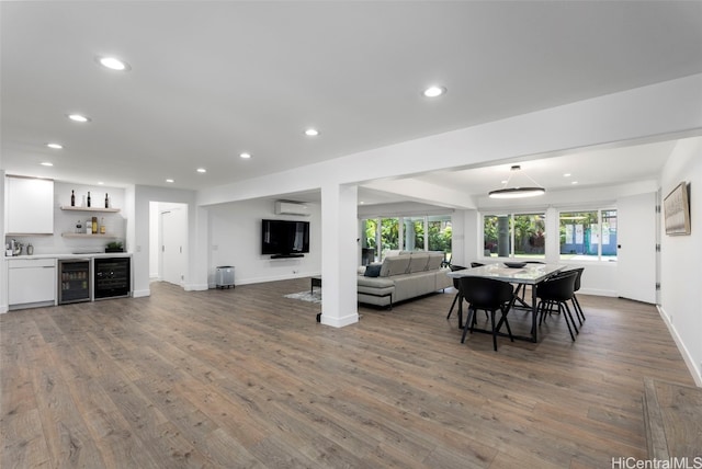 dining area with dark wood-type flooring, bar, and wine cooler