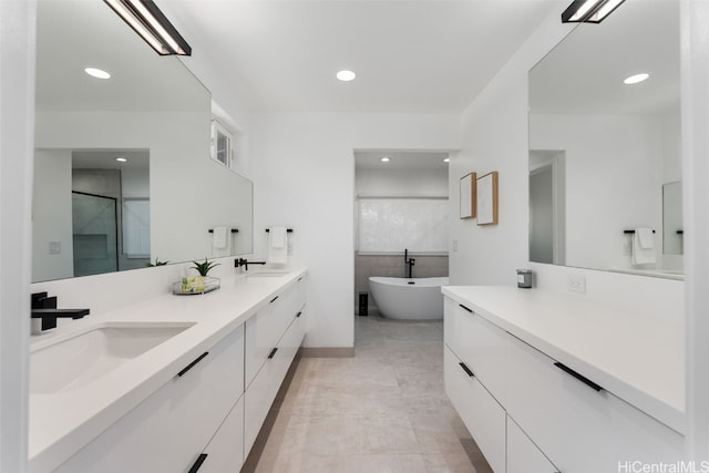 bathroom with vanity and plus walk in shower