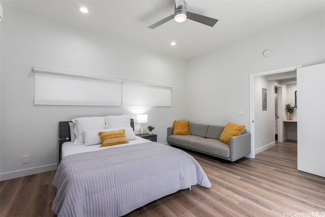 bedroom featuring hardwood / wood-style floors and ceiling fan