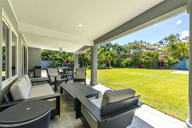 view of patio / terrace with an outdoor living space and ceiling fan