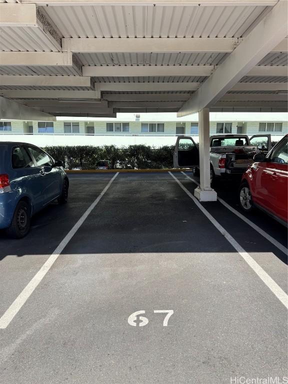 view of parking featuring a carport