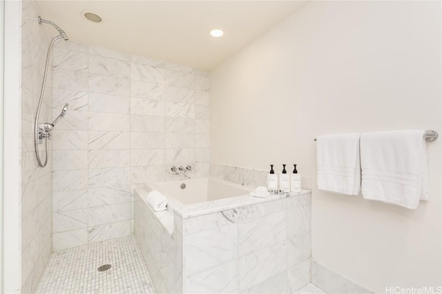 full bathroom featuring tiled shower, a bath, and recessed lighting