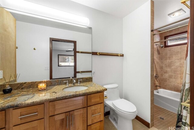 full bathroom featuring vanity, toilet, tile patterned flooring, and shower / bath combo with shower curtain