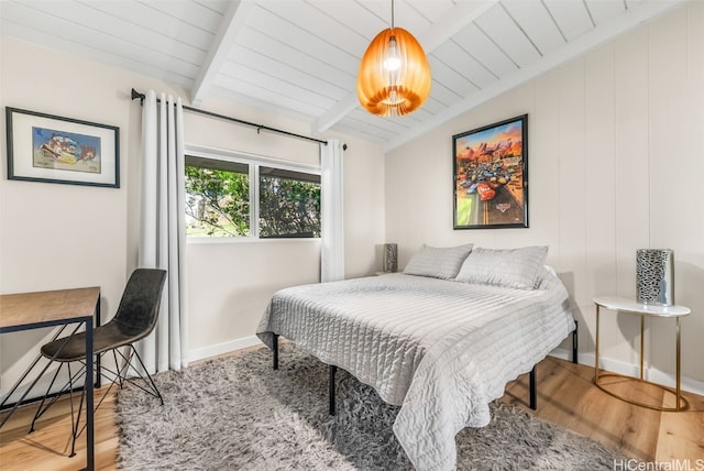 bedroom with hardwood / wood-style floors, wood ceiling, and lofted ceiling with beams