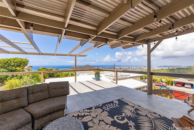 view of patio / terrace featuring a water view and an outdoor hangout area