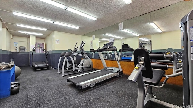 workout area with a textured ceiling