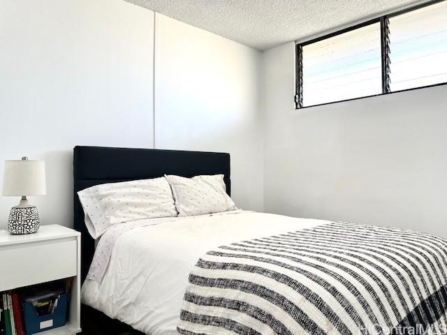 bedroom featuring a textured ceiling