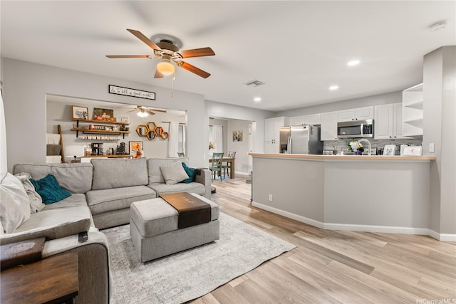 91-338 Makalea St Unit 52, Ewa Beach, HI 96706 - living area featuring ceiling fan, light wood-type flooring, and recessed lighting