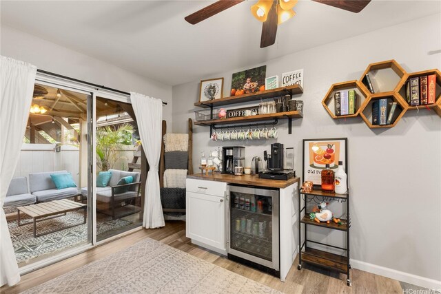 91-338 Makalea St Unit 52, Ewa Beach, HI 96706 - indoor wet bar with beverage cooler, light wood-style flooring, and a ceiling fan