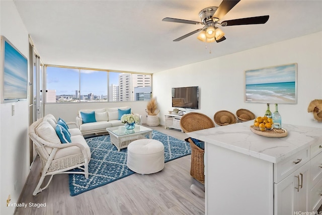 1617 Clark St Unit 702, Honolulu, HI 96822 - living area featuring wood finished floors and ceiling fan