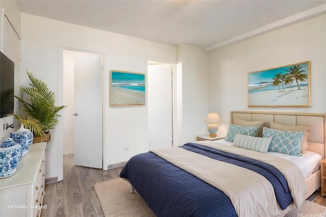 1617 Clark St Unit 702, Honolulu, HI 96822 - bedroom featuring light wood-type flooring