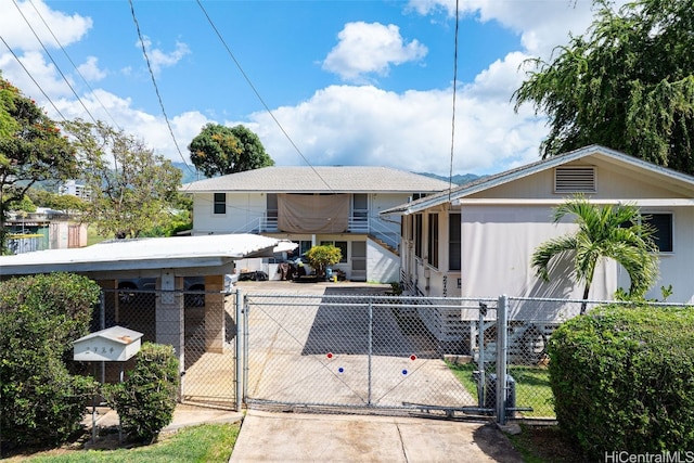 view of front of house featuring a fenced front yard and a gate