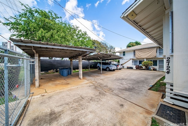 view of car parking with fence