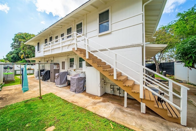 back of house with a patio, stairway, and fence